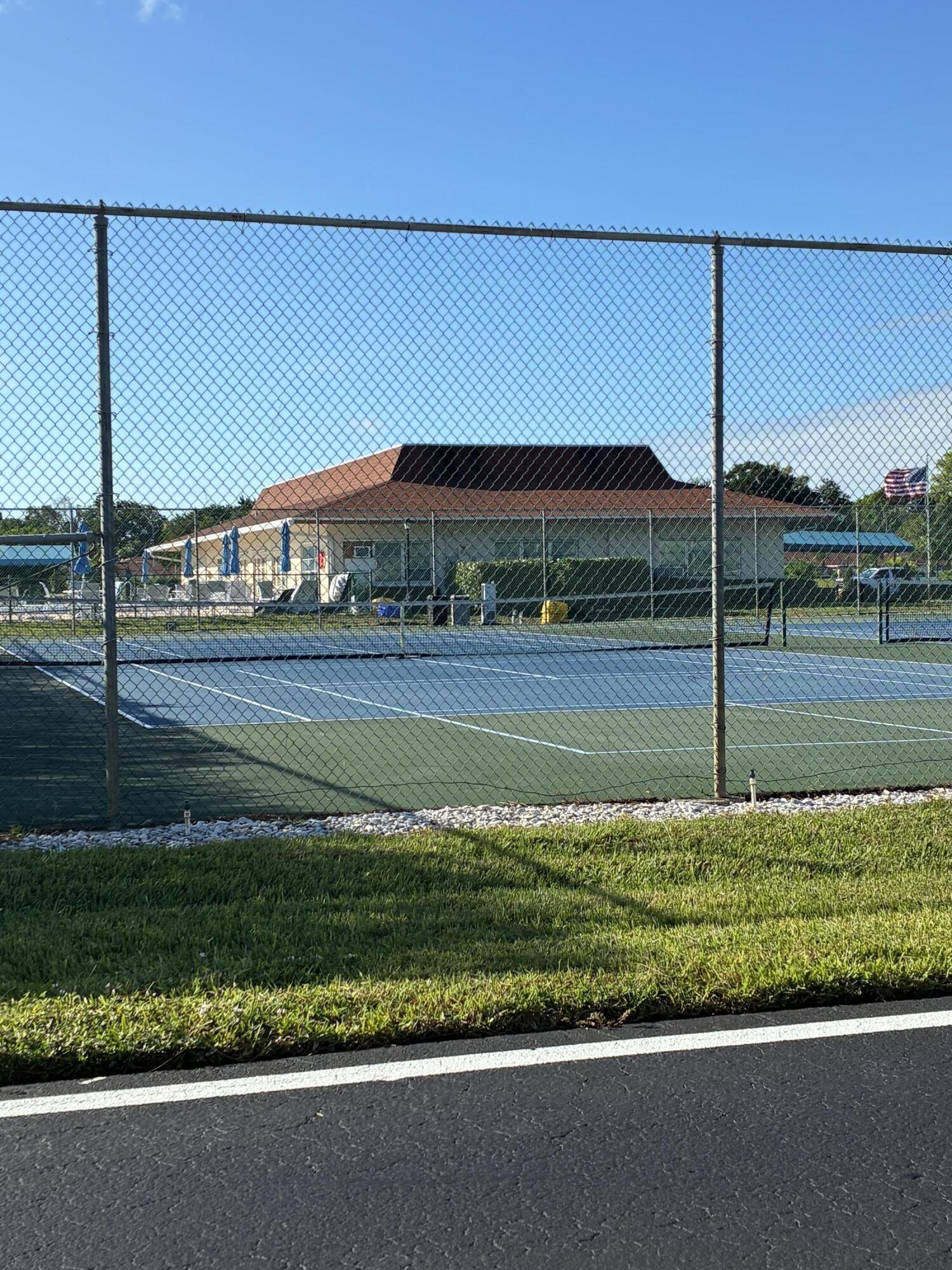 4540 Northwest 3rd Court, Unit C Delray Beach, FL 33445 - Photo 28 of 29 a view of a house and a big yard