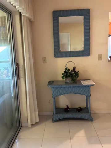a bathroom with a sink a mirror and a shower curtain