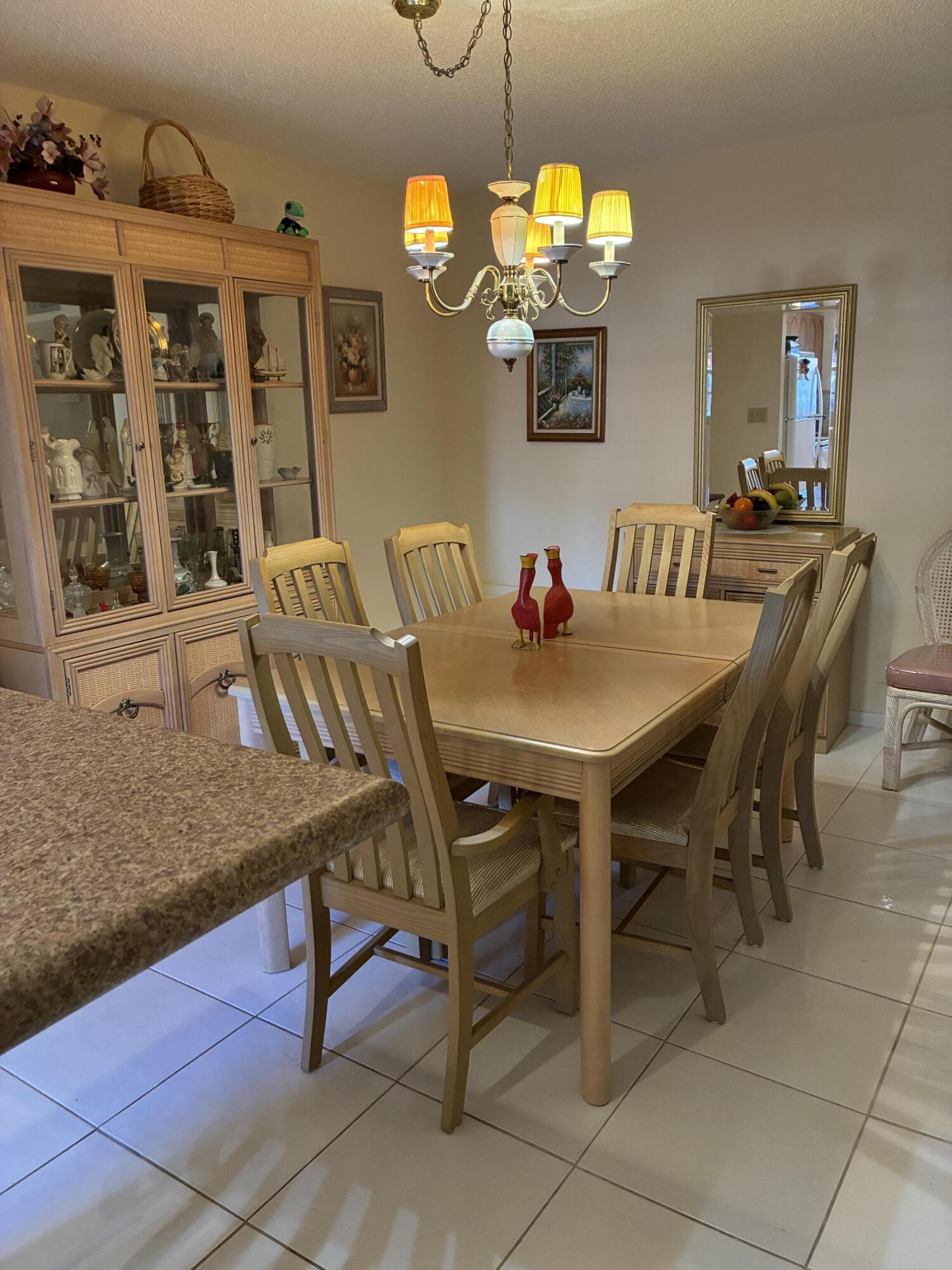 4540 Northwest 3rd Court, Unit C Delray Beach, FL 33445 - Photo 9 of 29 a view of a dining room with furniture