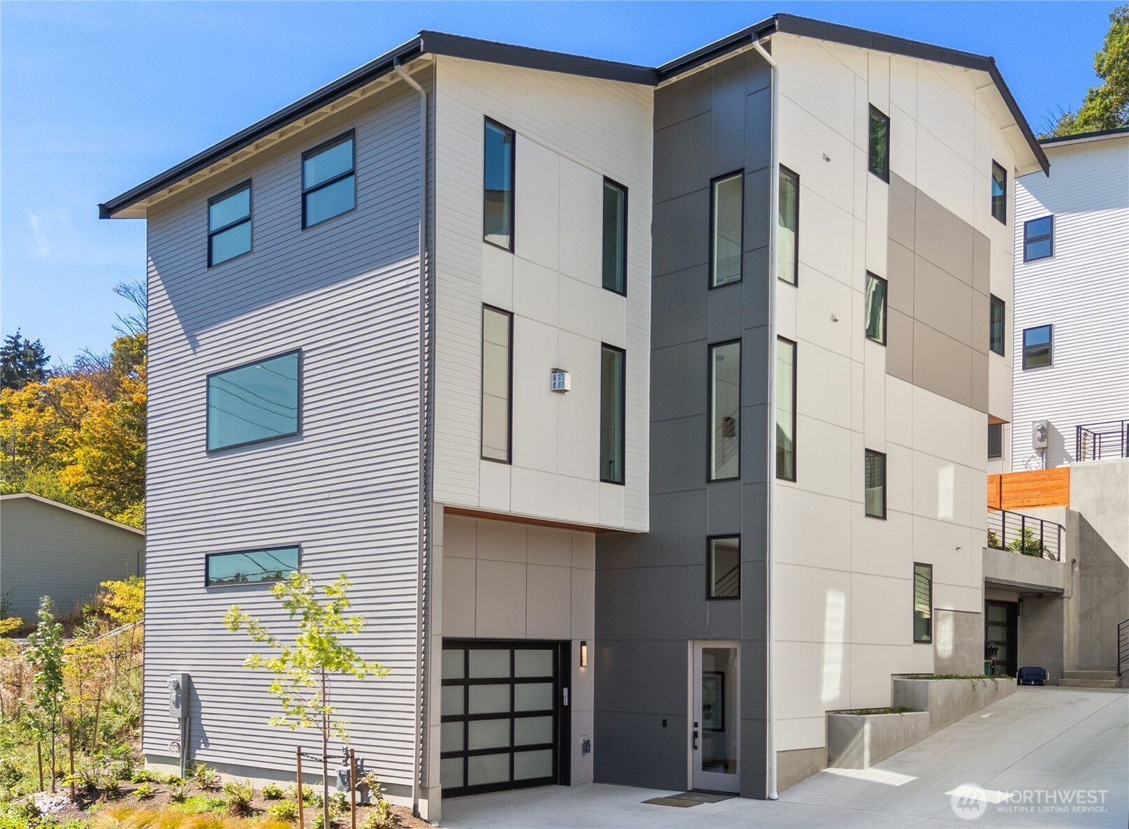 5244 23rd Avenue Southwest Seattle, WA 98106 - Photo 1 of 35 a front view of a building with glass windows