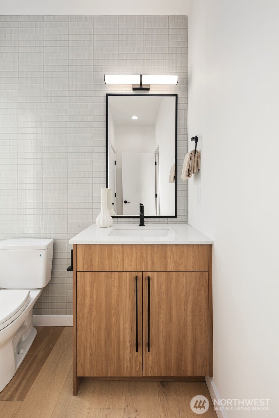 5244 23rd Avenue Southwest Seattle, WA 98106 - Photo 12 of 35 a bathroom with a sink vanity mirror and toilet