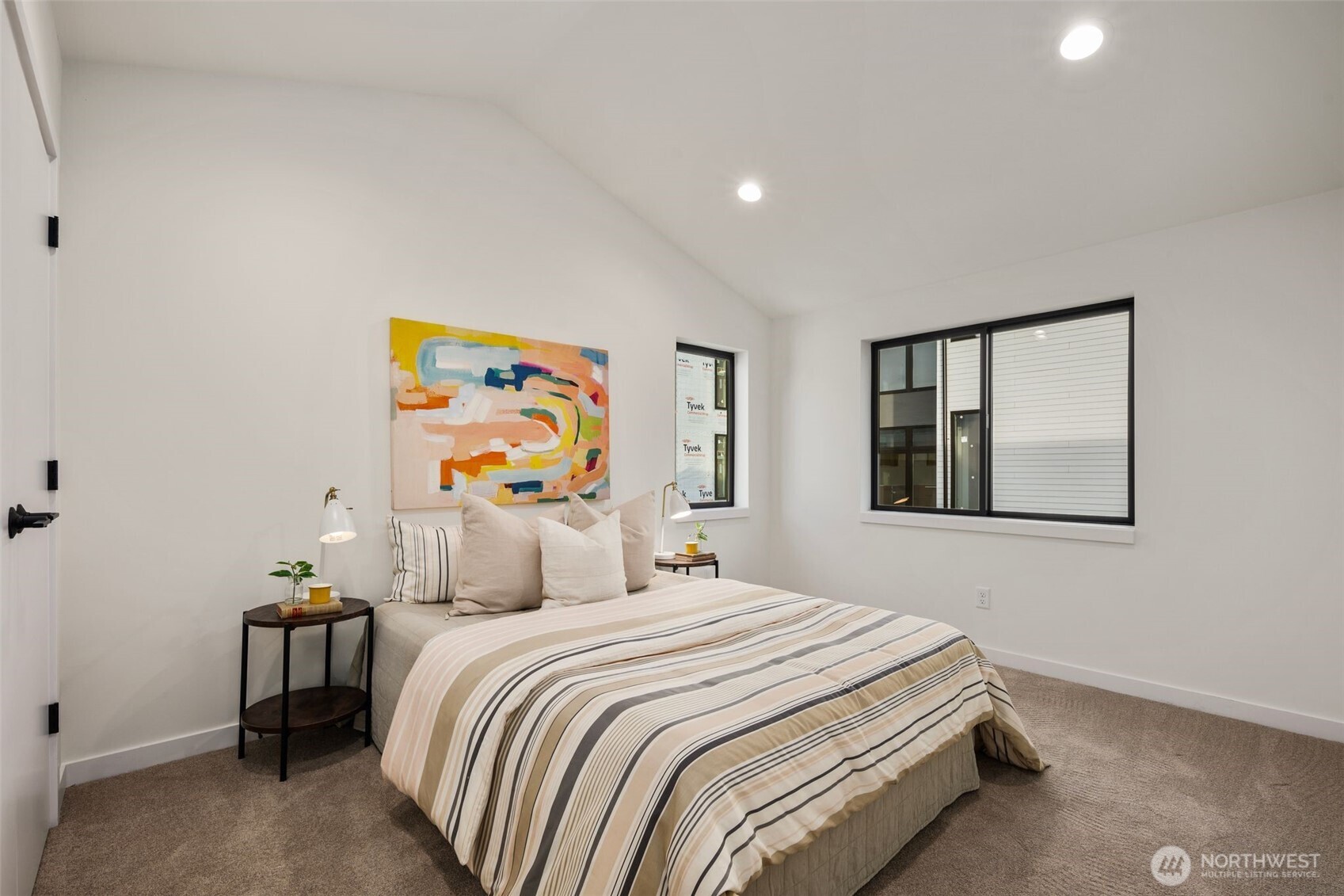 5244 23rd Avenue Southwest Seattle, WA 98106 - Photo 28 of 35 a bedroom with a bed and painting on the wall