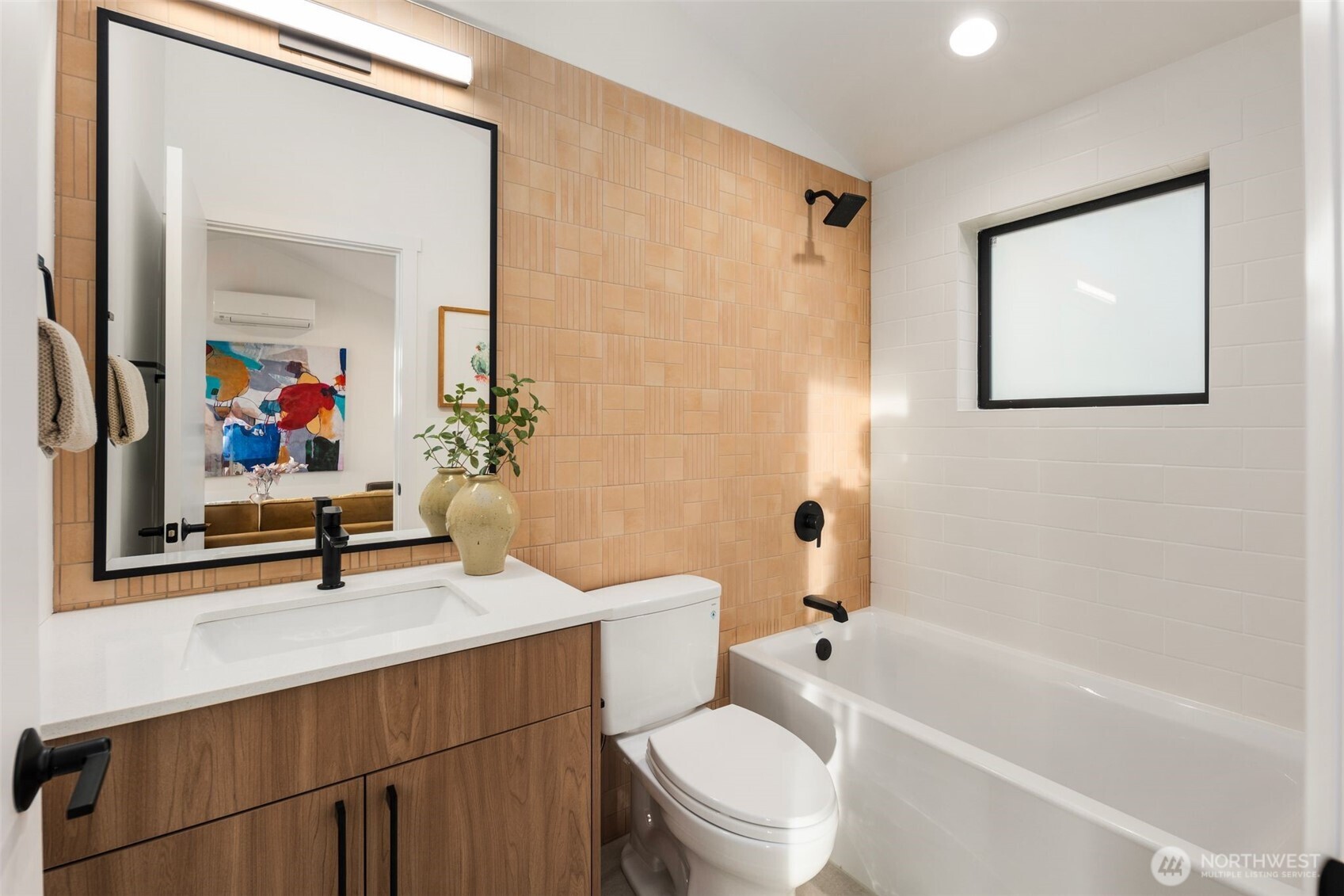 5244 23rd Avenue Southwest Seattle, WA 98106 - Photo 29 of 35 a bathroom with a sink a toilet and shower a mirror