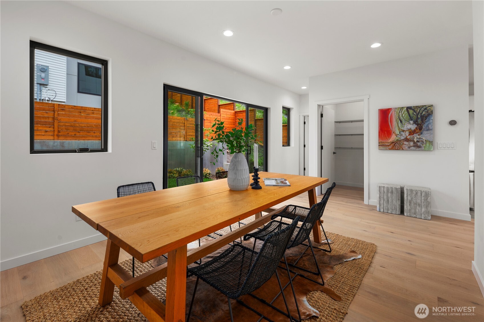 5244 23rd Avenue Southwest Seattle, WA 98106 - Photo 10 of 35 a view of a dining room and livingroom with furniture window and wooden floor