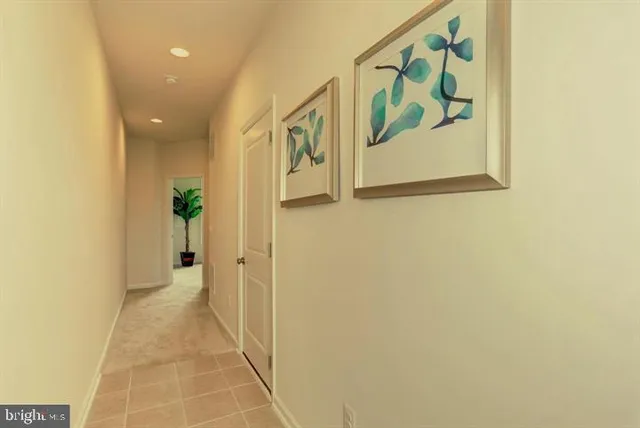 a view of a hallway with wooden wall