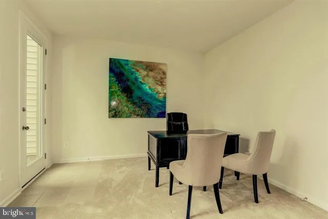 a view of a workspace with furniture