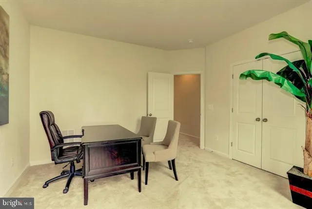 a workspace with furniture and a potted plant