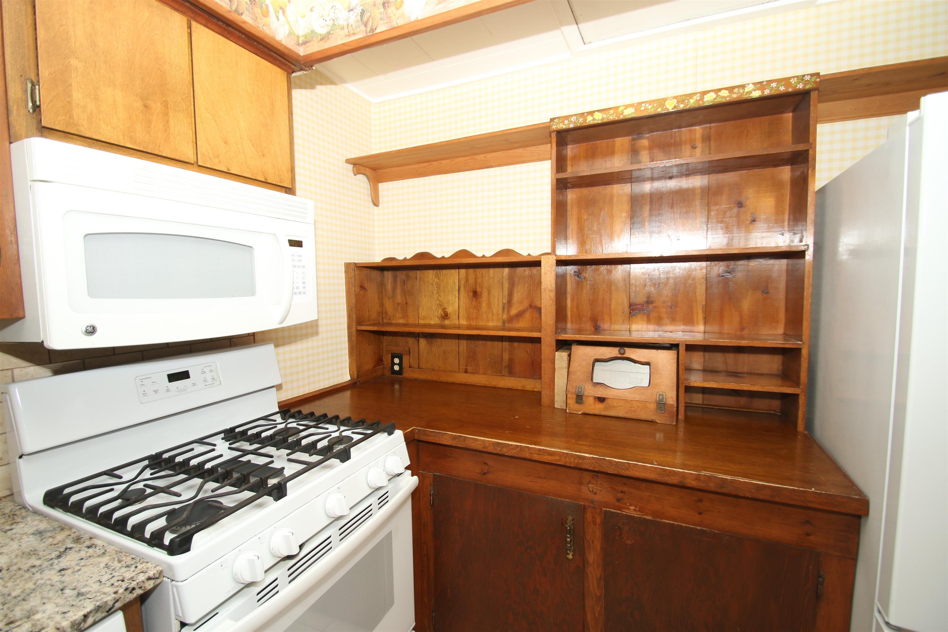 10926 Hill Road Garden Prairie, IL 61038 - Photo 11 of 53 a kitchen with a stove and a microwave