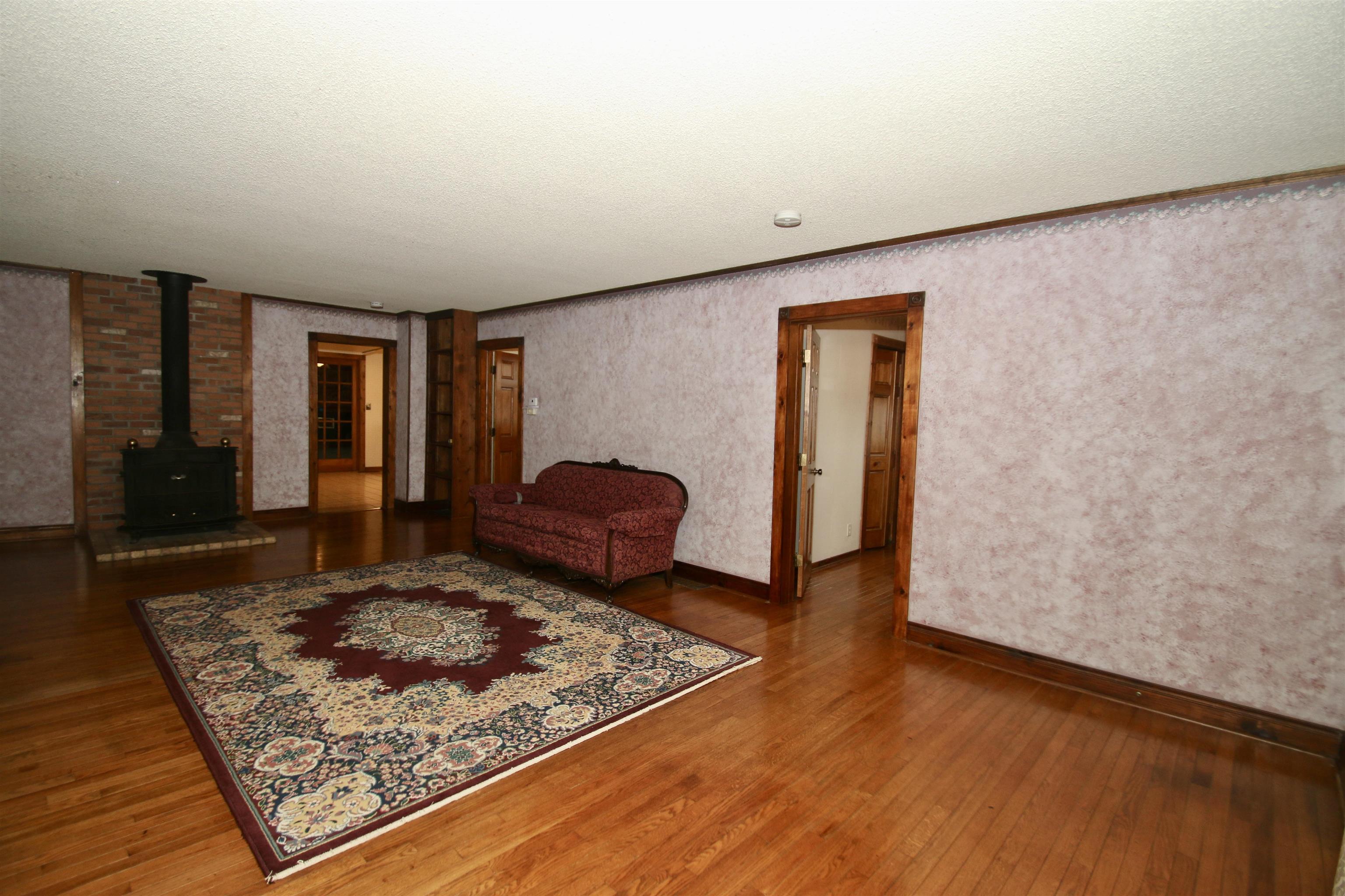 10926 Hill Road Garden Prairie, IL 61038 - Photo 15 of 53 a living room with couch rug and a table