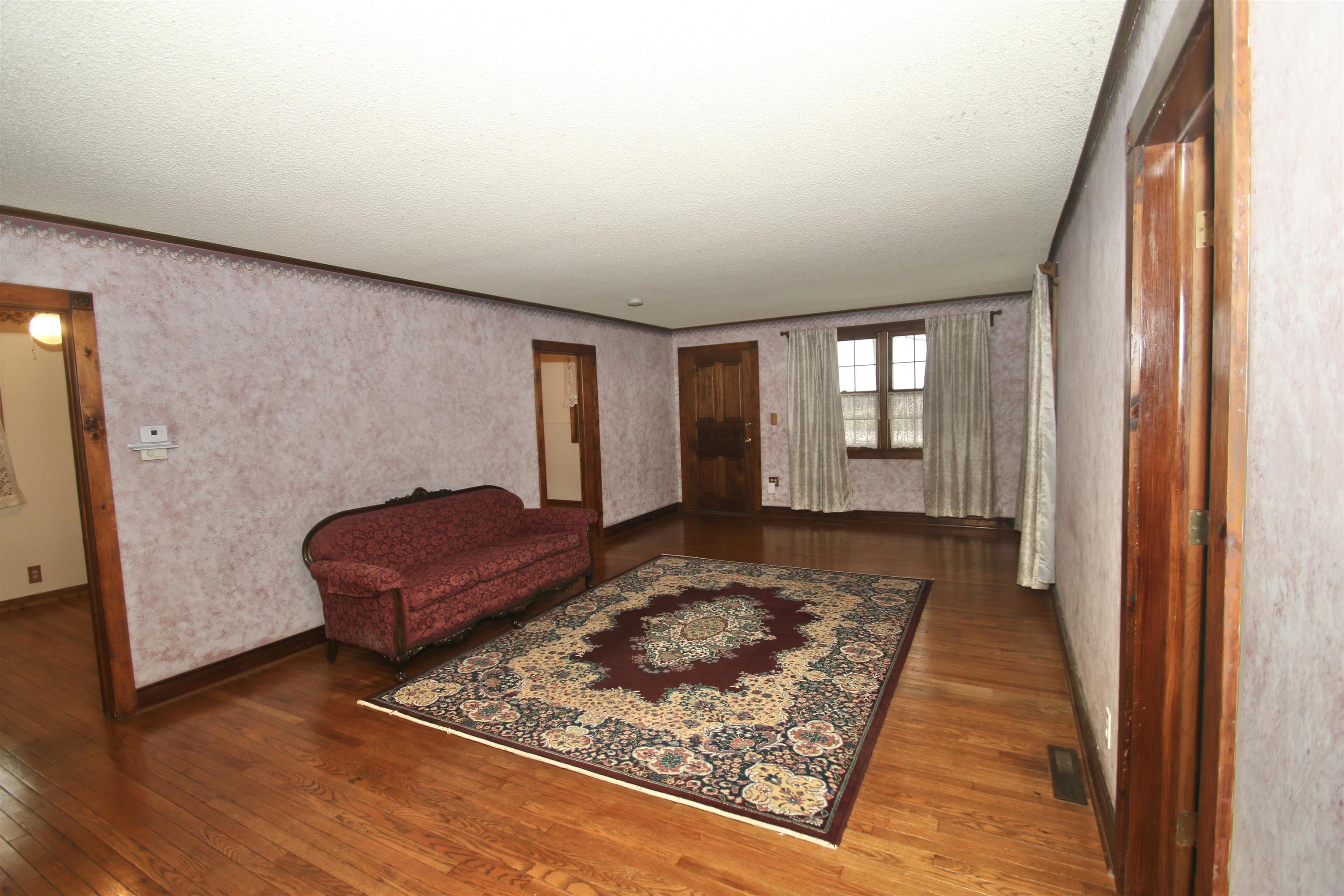 10926 Hill Road Garden Prairie, IL 61038 - Photo 17 of 53 a view of a bedroom with furniture and wooden floor