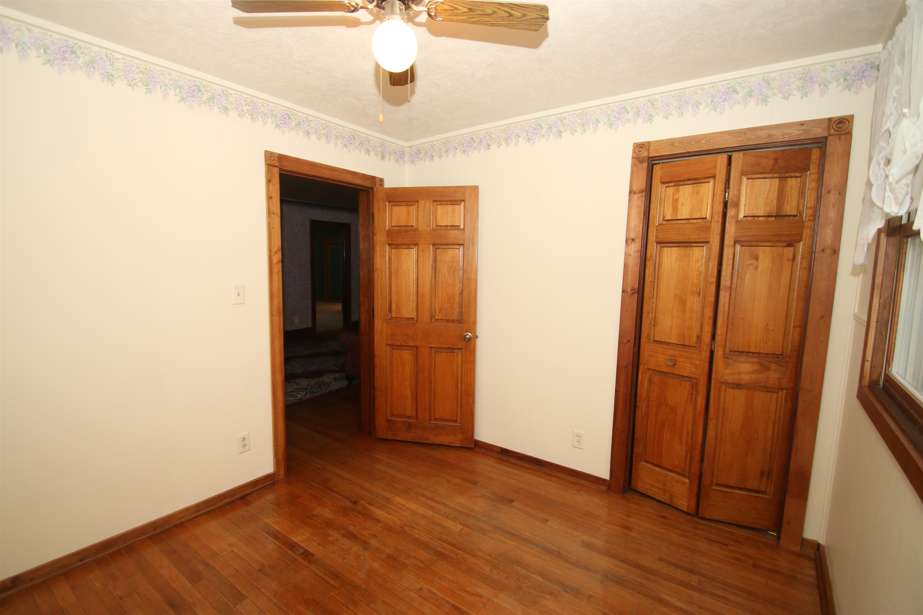 10926 Hill Road Garden Prairie, IL 61038 - Photo 25 of 53 an empty room with wooden floor and closet