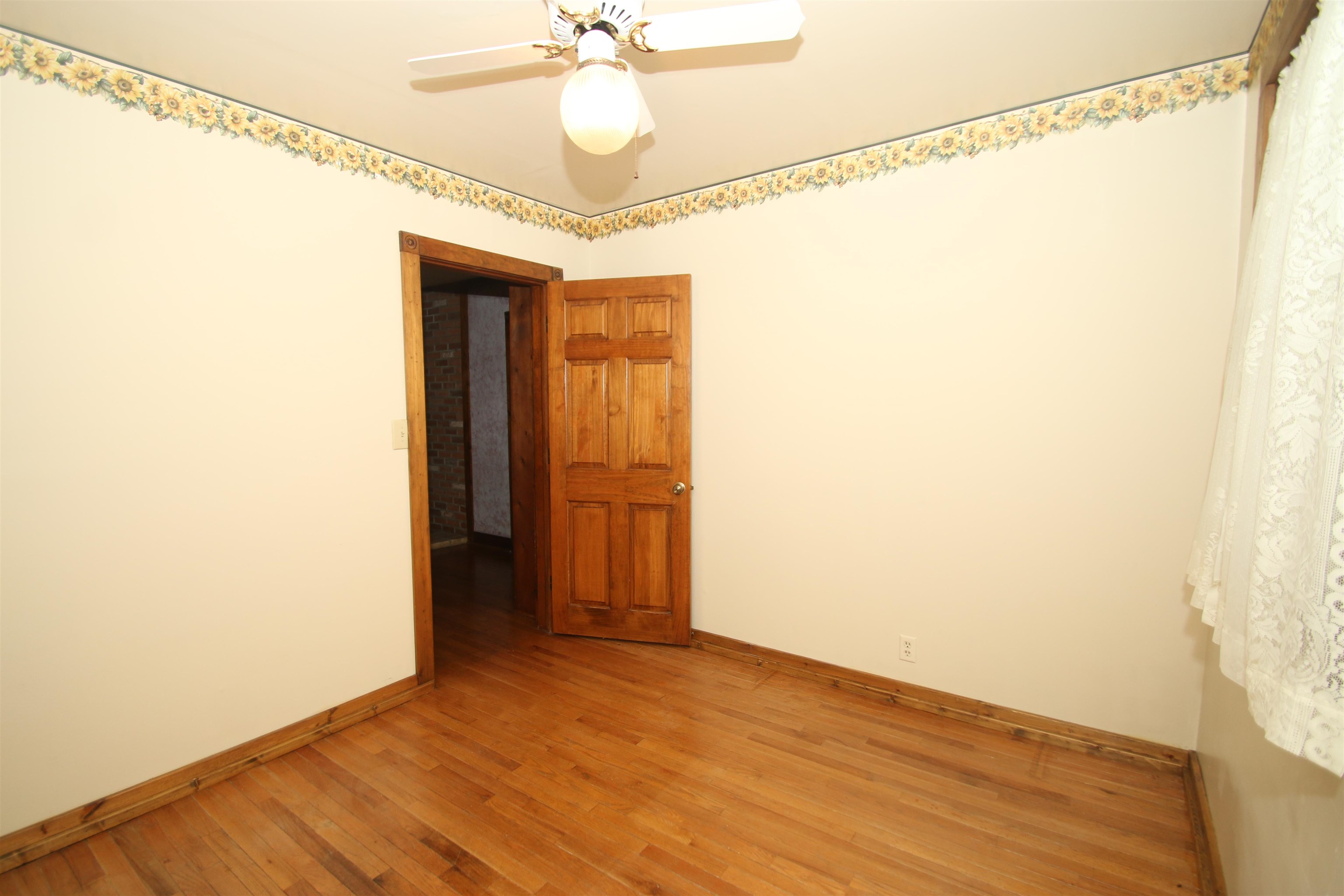 10926 Hill Road Garden Prairie, IL 61038 - Photo 28 of 53 a view of empty room with wooden floor and fan