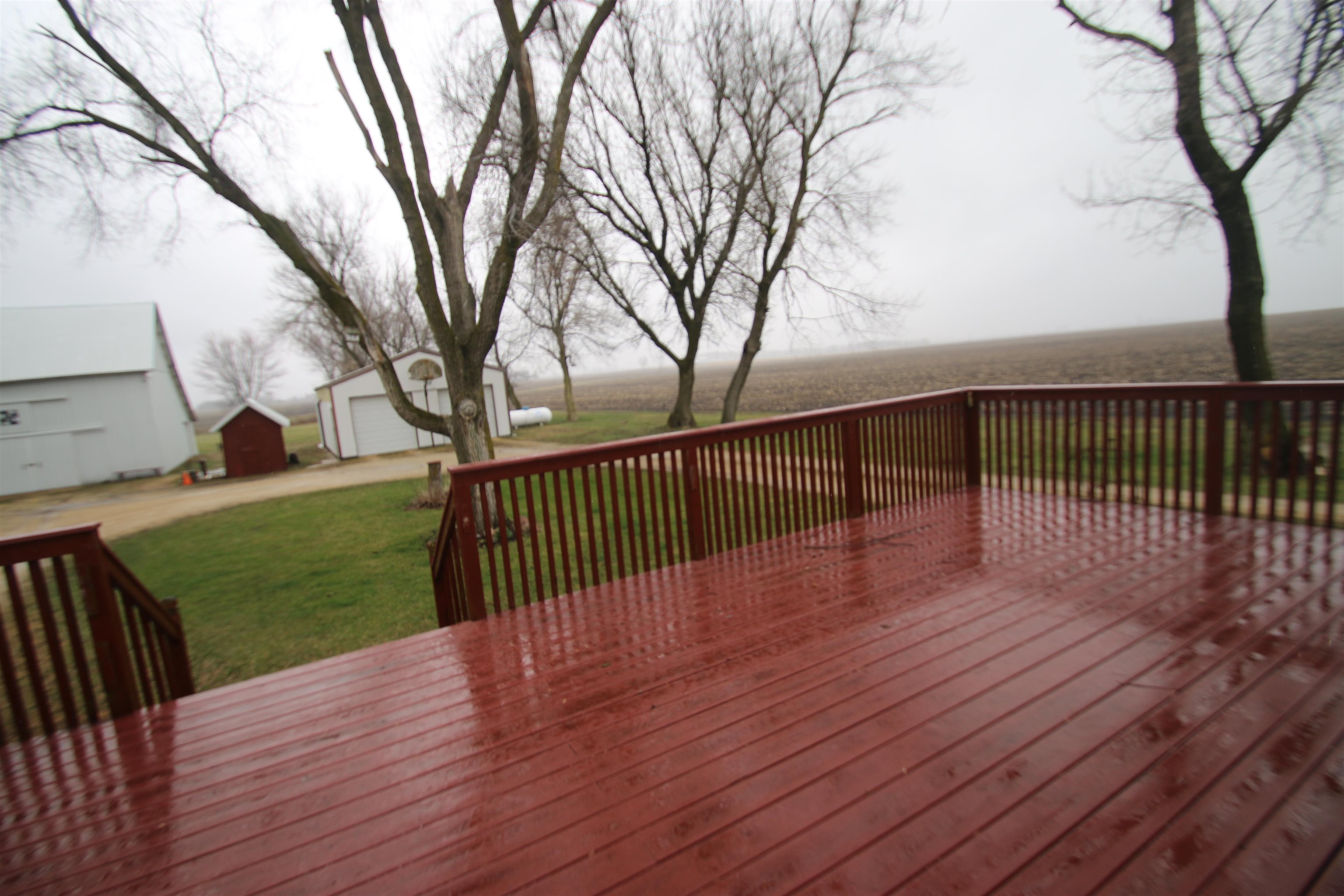 10926 Hill Road Garden Prairie, IL 61038 - Photo 30 of 53 a view of deck with wooden floor and fence and trees