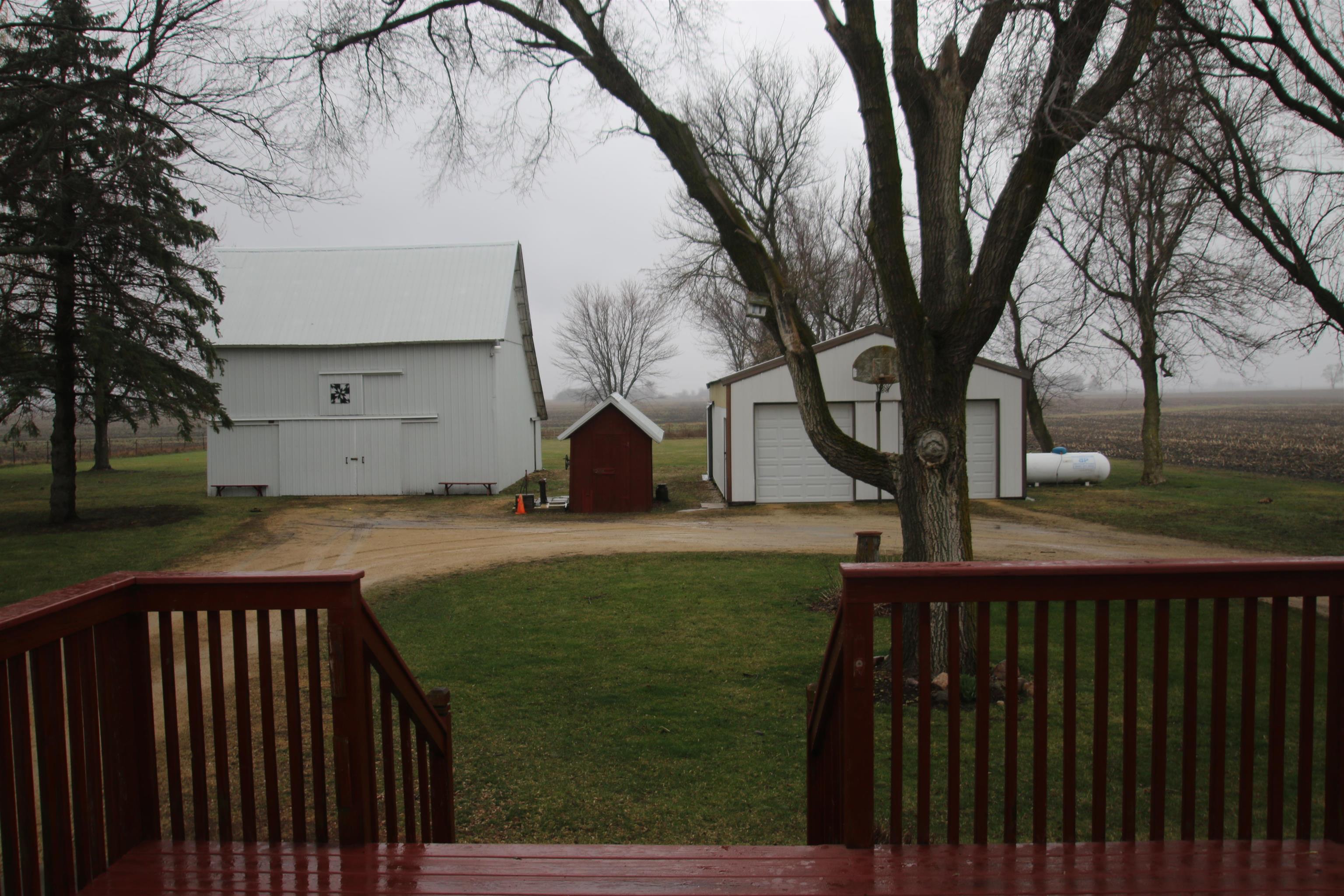 10926 Hill Road Garden Prairie, IL 61038 - Photo 34 of 53 a view of backyard with wooden fence and a large tree