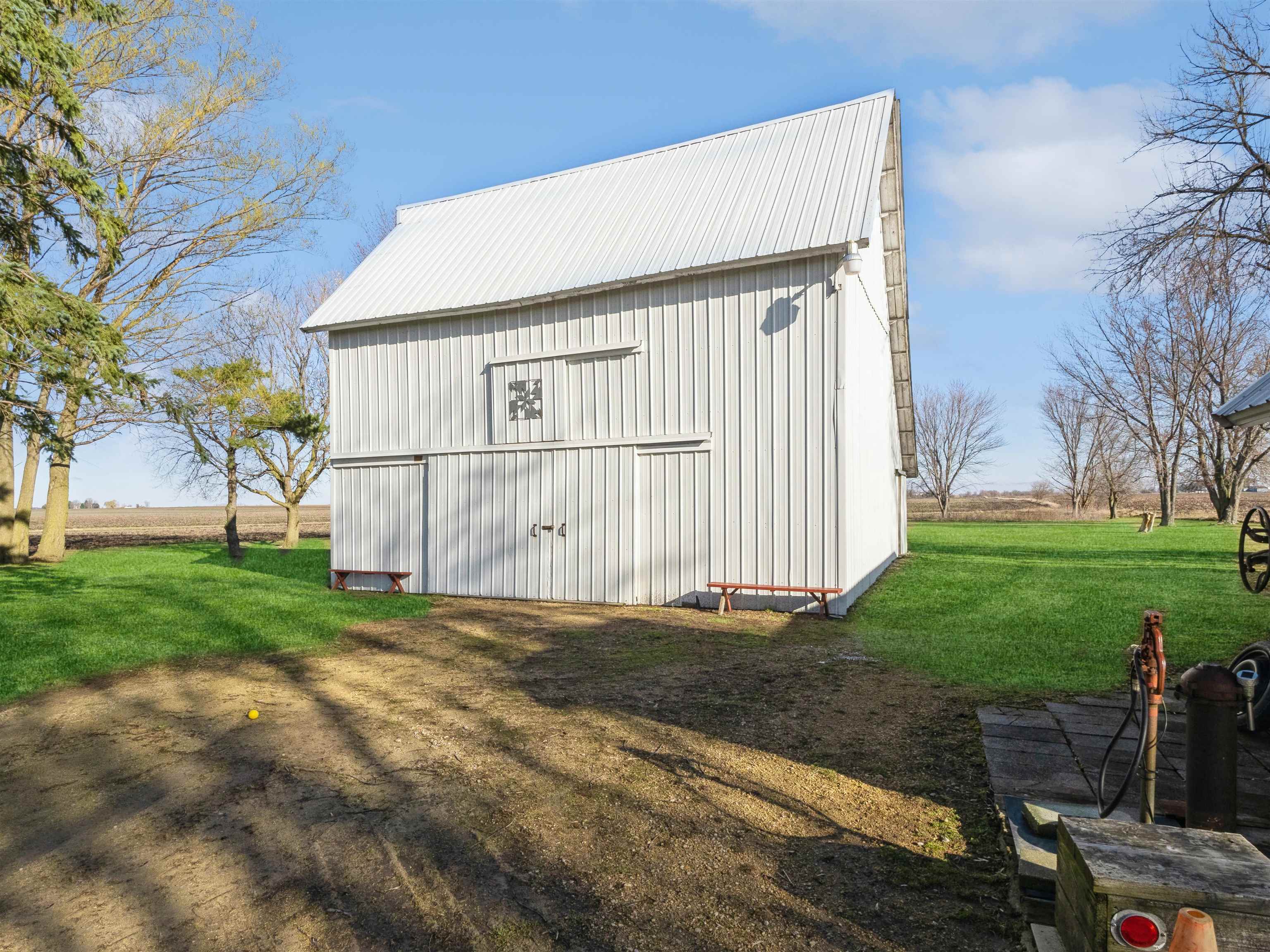 10926 Hill Road Garden Prairie, IL 61038 - Photo 42 of 53 a view of a house with backyard and a garden