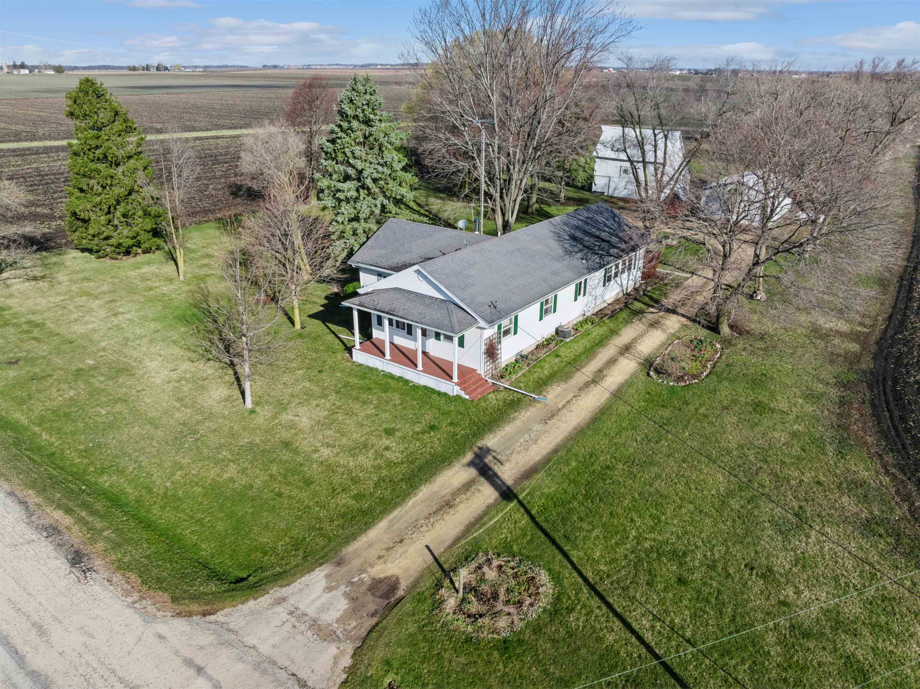 10926 Hill Road Garden Prairie, IL 61038 - Photo 43 of 53 a view of a house with a yard and potted plants