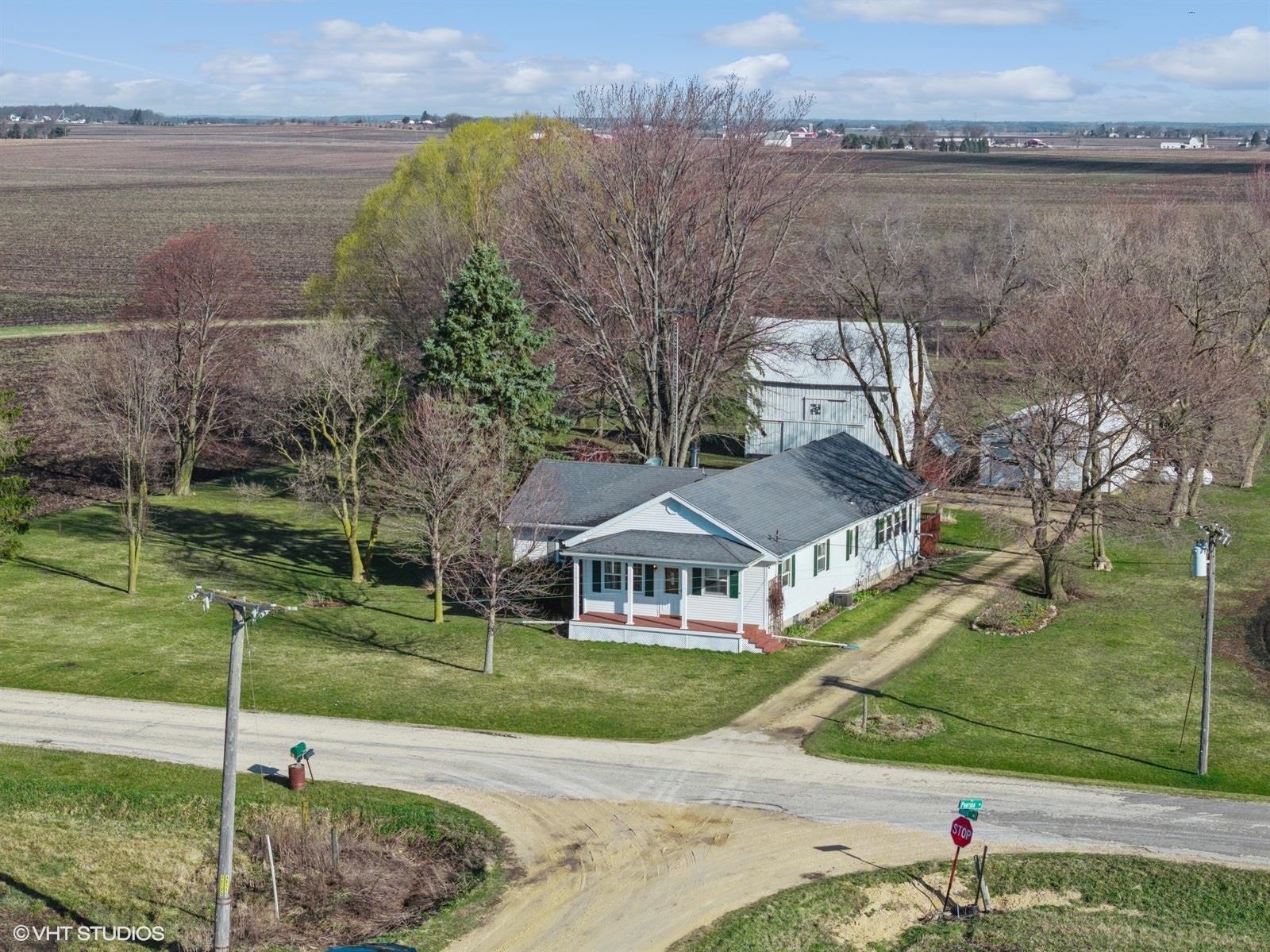 10926 Hill Road Garden Prairie, IL 61038 - Photo 44 of 53 a aerial view of a house with a yard and a fountain