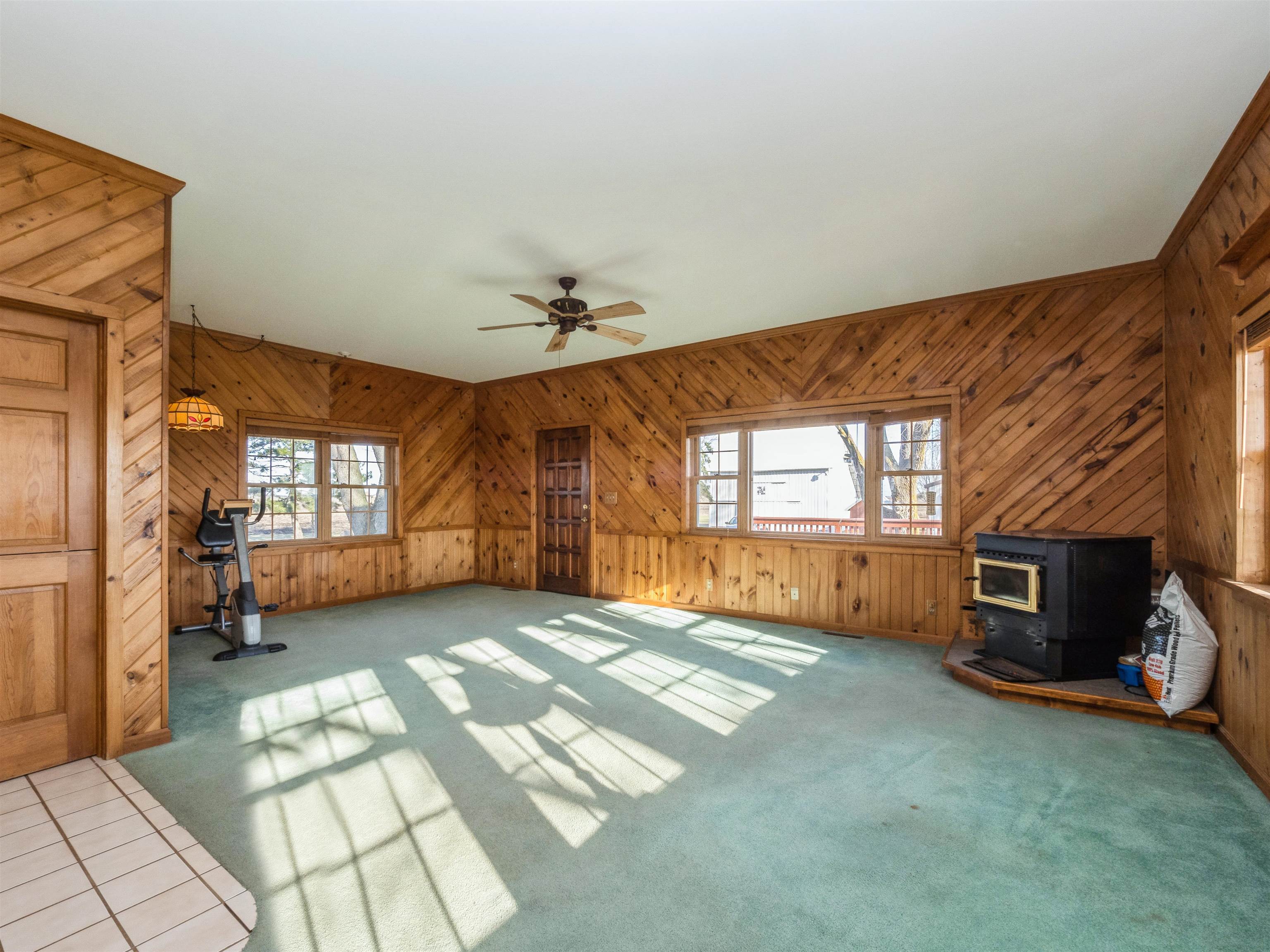 10926 Hill Road Garden Prairie, IL 61038 - Photo 6 of 53 a view of a livingroom with a fireplace and window