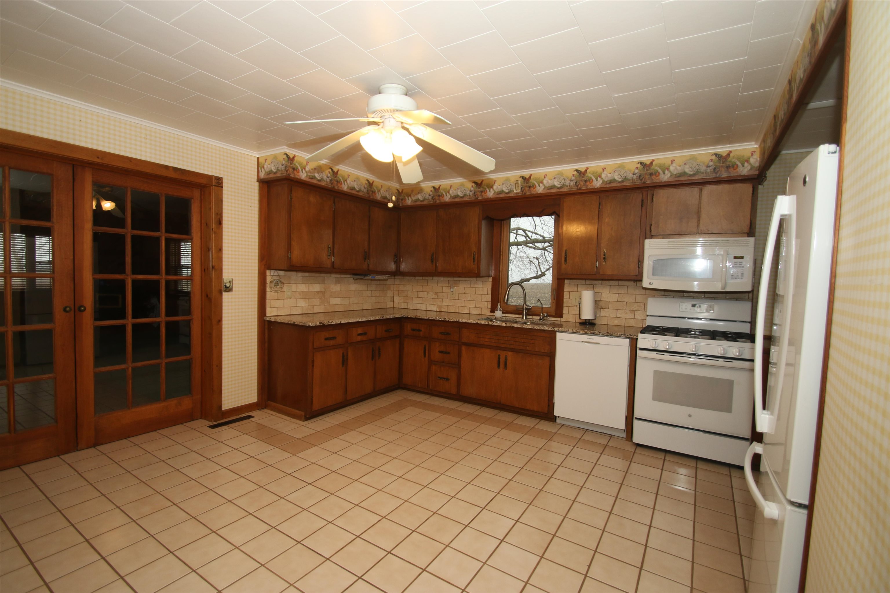 10926 Hill Road Garden Prairie, IL 61038 - Photo 9 of 53 a kitchen with stainless steel appliances a sink and a refrigerator
