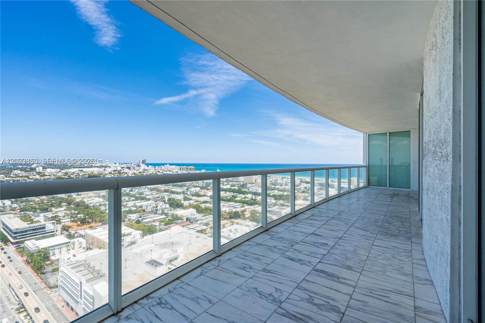 a view of balcony with furniture