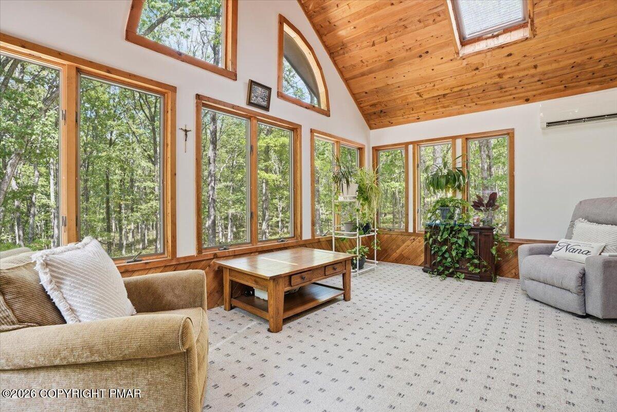 1517 Deer Run East Bushkill, PA 18324 - Photo 11 of 42 a living room with furniture and large windows