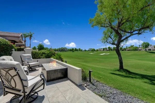 a yard with table and a chairs