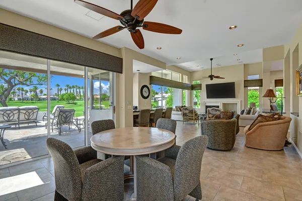 a view of a dining room with furniture window and outside view