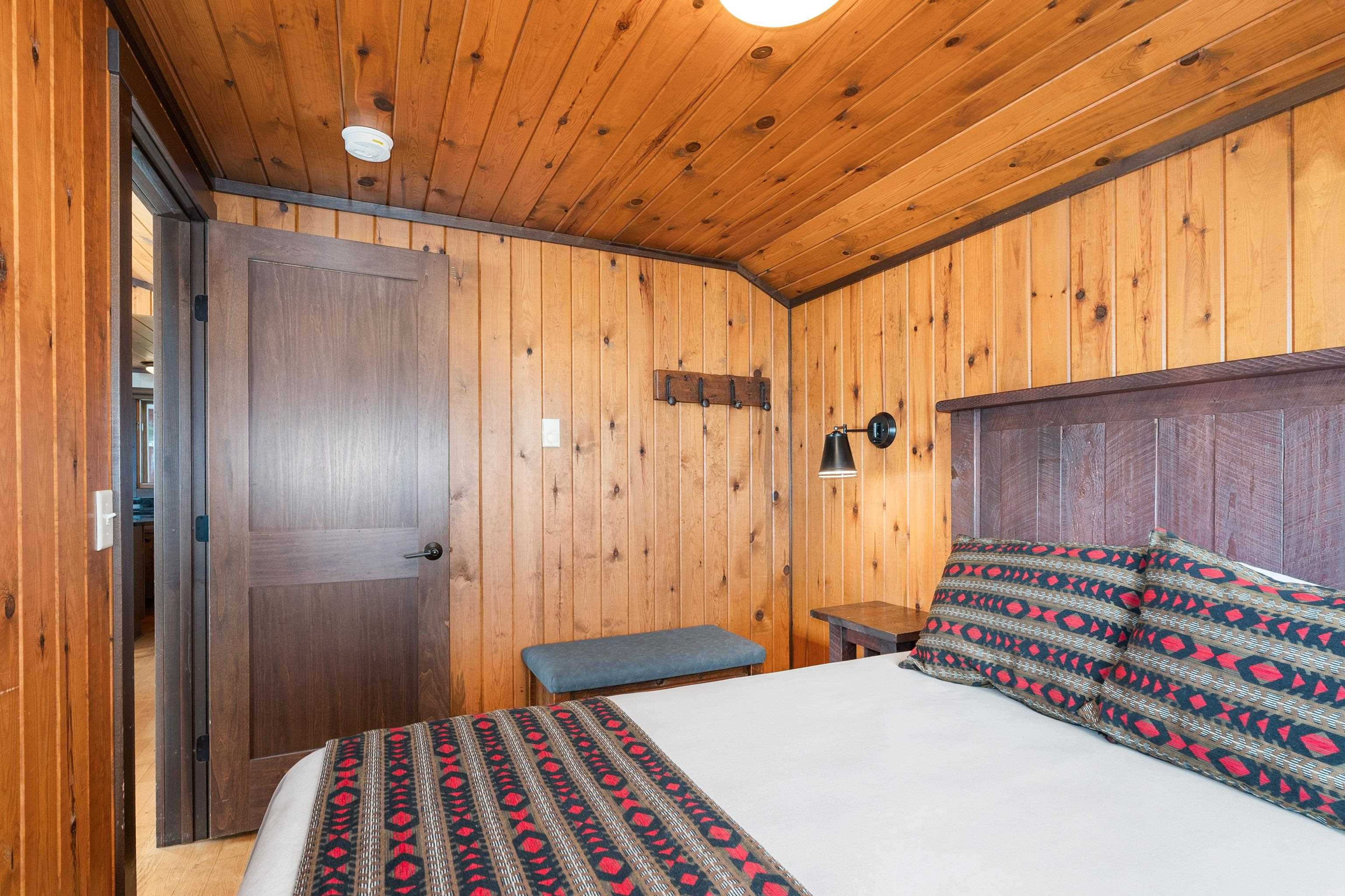 540 Old North Shore Road, Unit 7 Two Harbors, MN 55616 - Photo 23 of 61 Bedroom featuring wooden walls and wooden ceiling