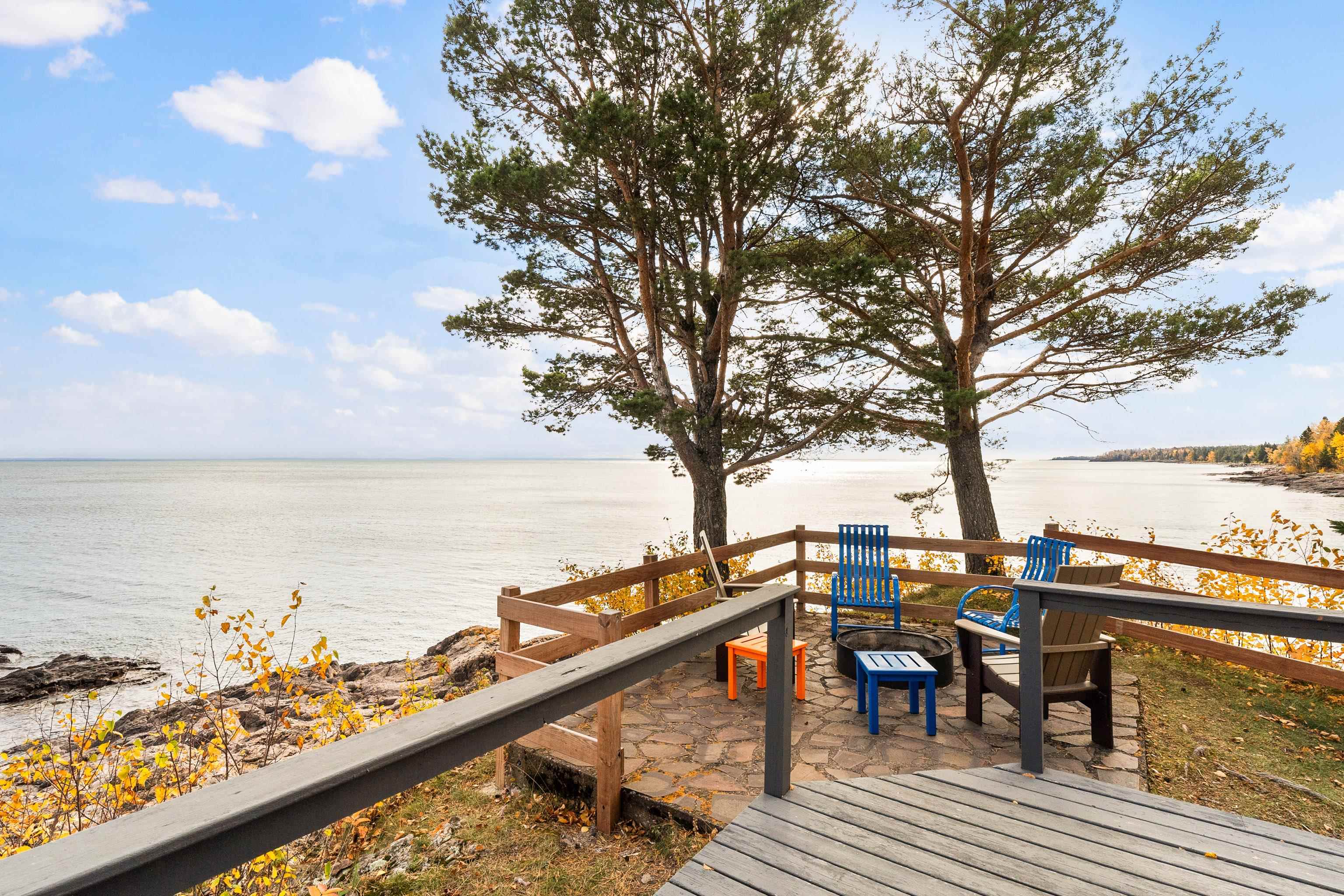 540 Old North Shore Road, Unit 7 Two Harbors, MN 55616 - Photo 30 of 61 Wooden terrace with a water view and a patio area