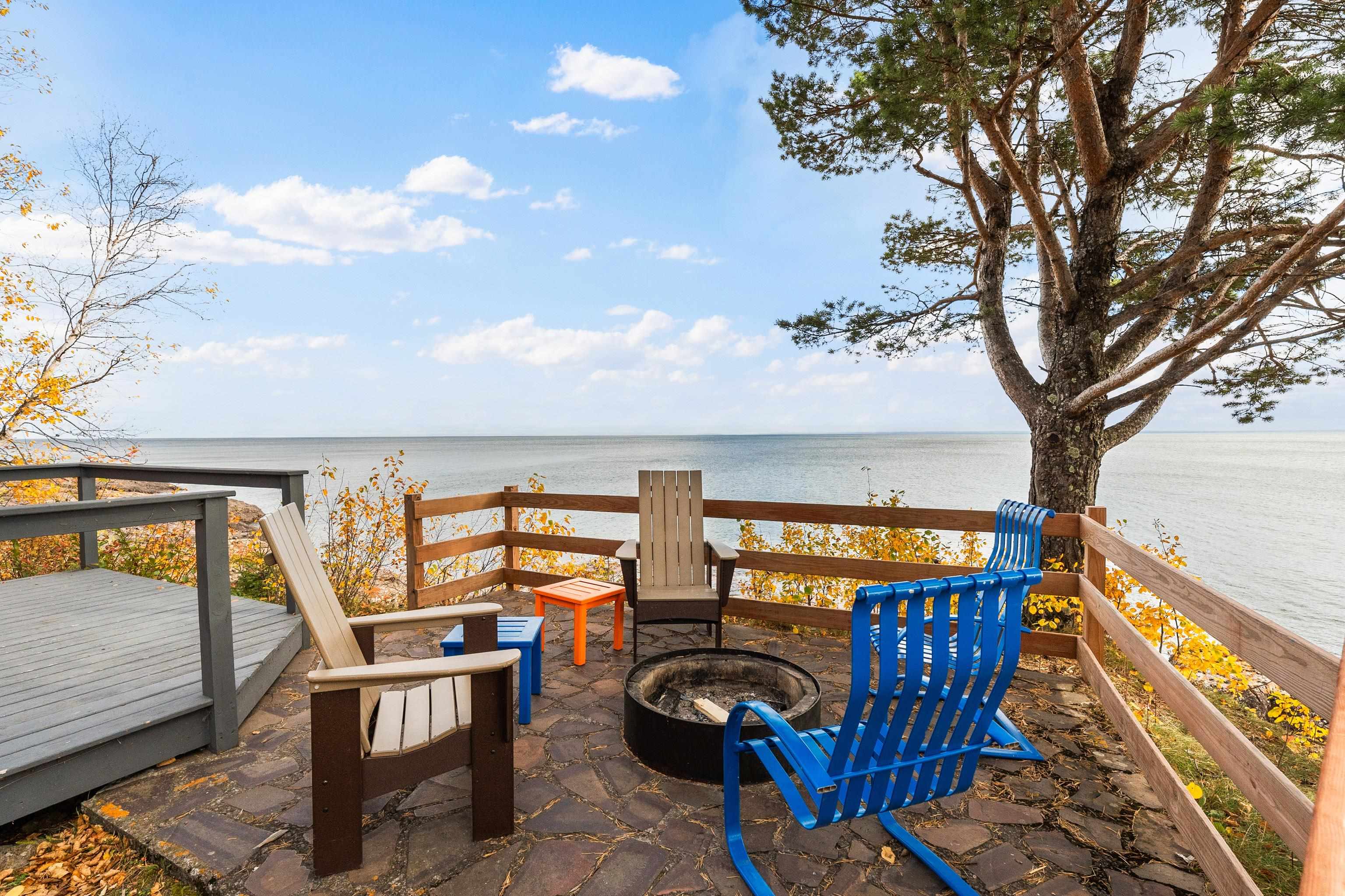 540 Old North Shore Road, Unit 7 Two Harbors, MN 55616 - Photo 33 of 61 Wooden terrace with a water view and an outdoor fire pit