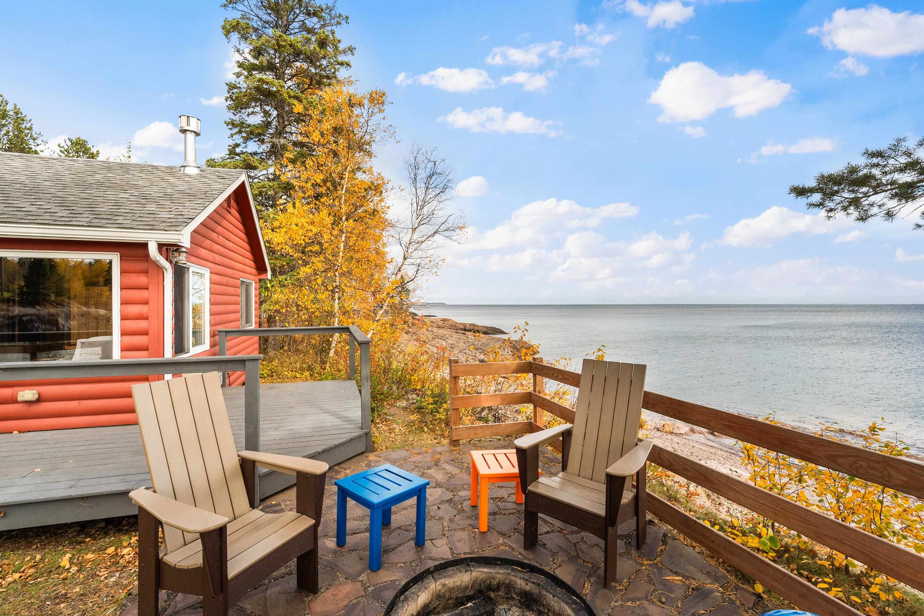 540 Old North Shore Road, Unit 7 Two Harbors, MN 55616 - Photo 34 of 61 Wooden terrace with an outdoor fire pit and a water view