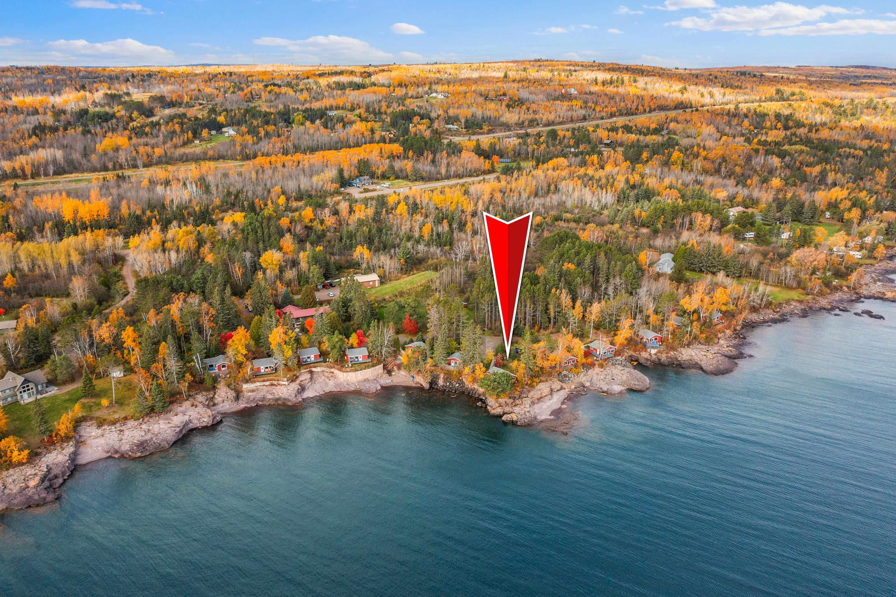 540 Old North Shore Road, Unit 7 Two Harbors, MN 55616 - Photo 49 of 61 Aerial view of property and surrounding area featuring a large body of water and a forest