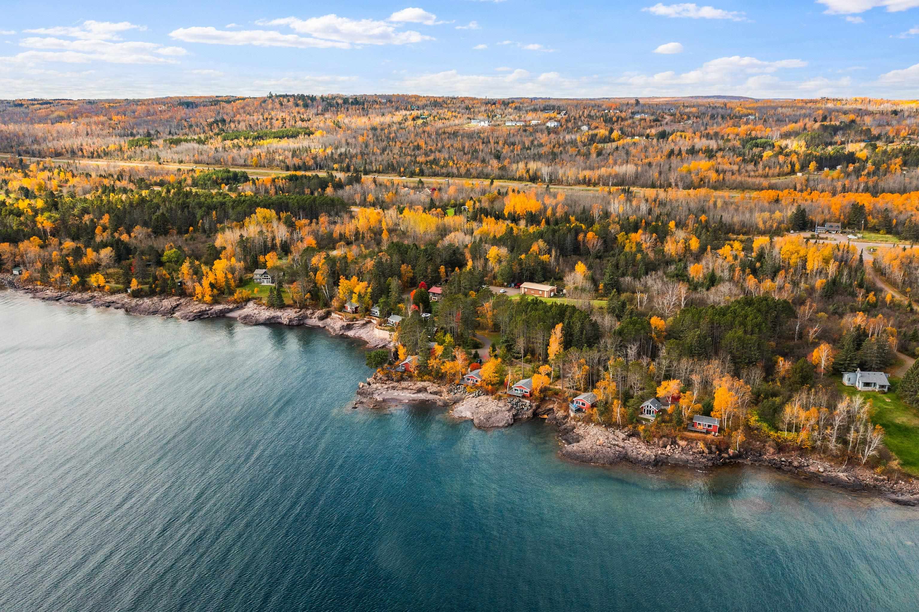 540 Old North Shore Road, Unit 7 Two Harbors, MN 55616 - Photo 61 of 61 Drone / aerial view of a large body of water and a heavily wooded area
