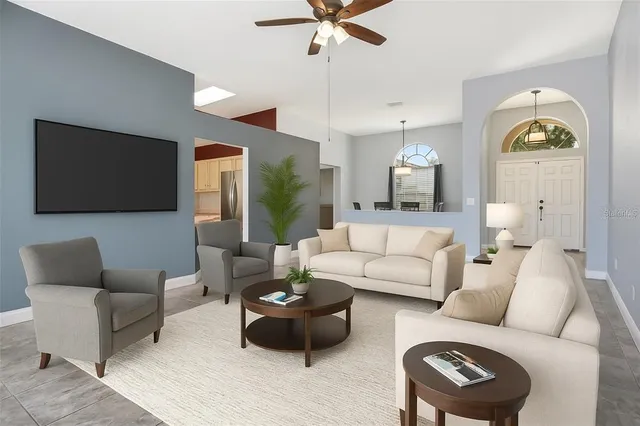 a living room with furniture and a flat screen tv