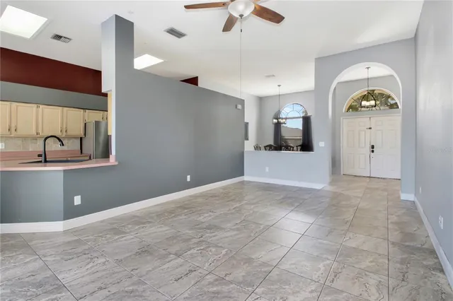 a view of a kitchen with a sink and a chandelier