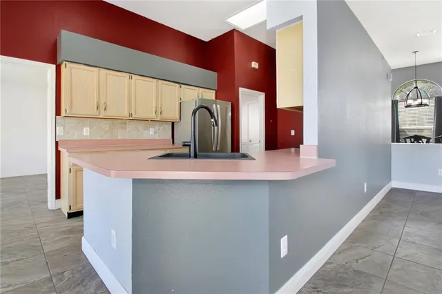 a kitchen with stainless steel appliances a sink and cabinets