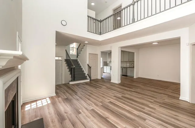a view of an entryway with wooden floor