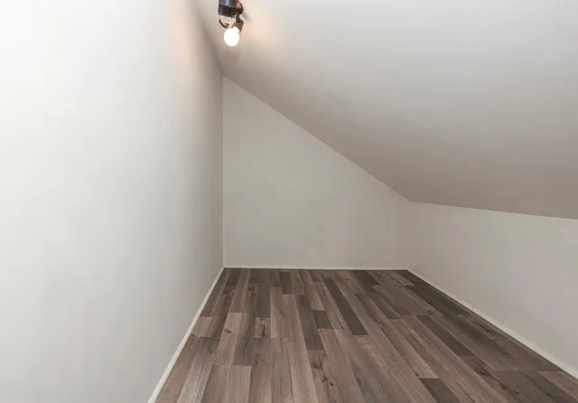 a view of wooden floor in a bathroom