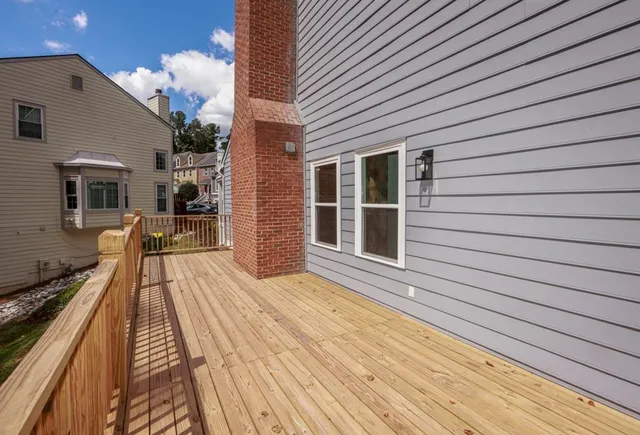a view of a house with backyard and porch