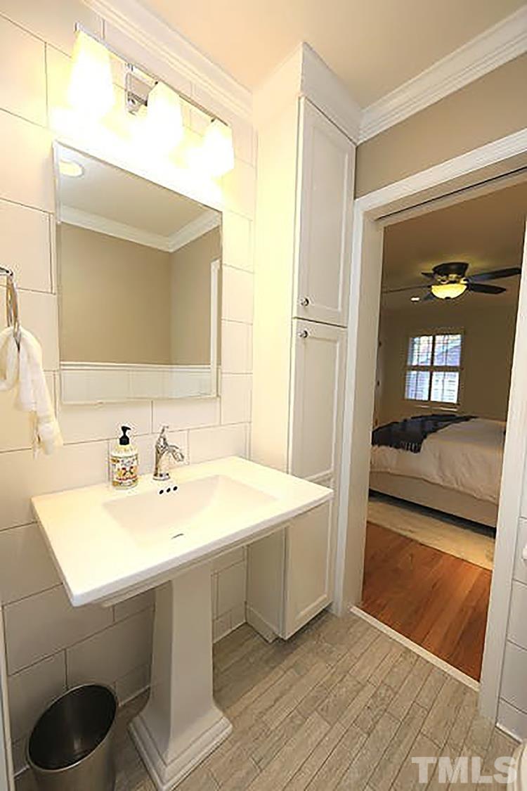 4229 Rowan Street Raleigh, NC 27609 - Photo 16 of 30 a bathroom with a sink and a mirror