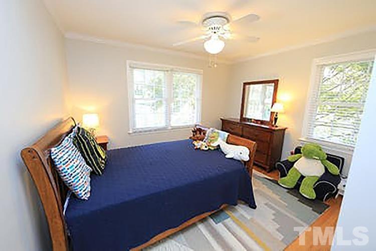 4229 Rowan Street Raleigh, NC 27609 - Photo 18 of 30 a bedroom with furniture and a window