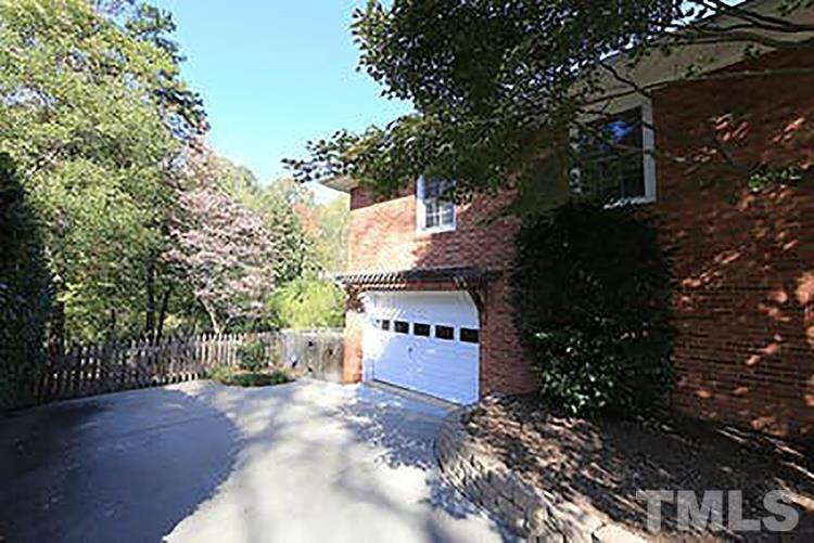 4229 Rowan Street Raleigh, NC 27609 - Photo 2 of 30 a view of a yard with plants and trees