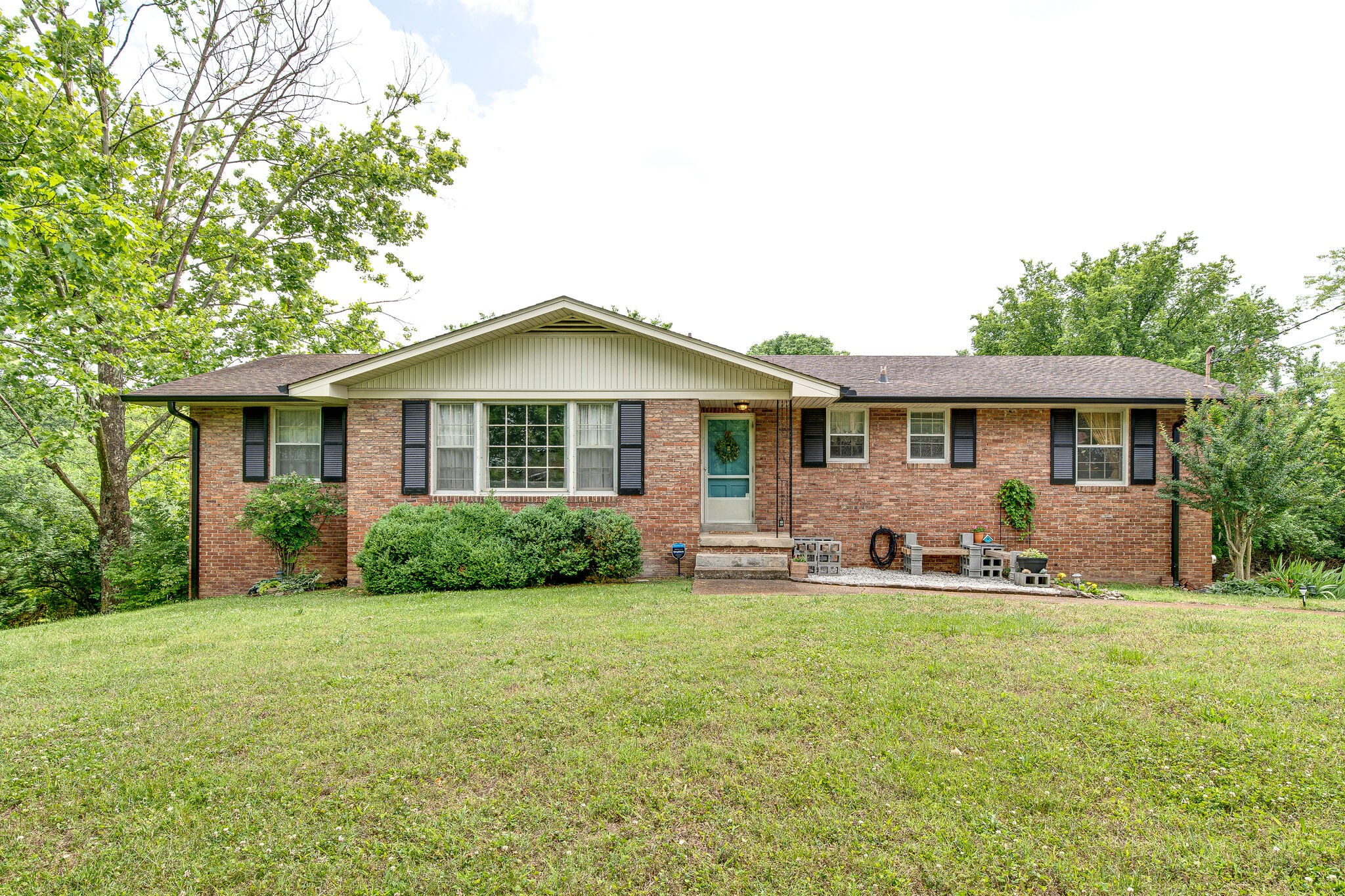 a front view of house with yard and porch