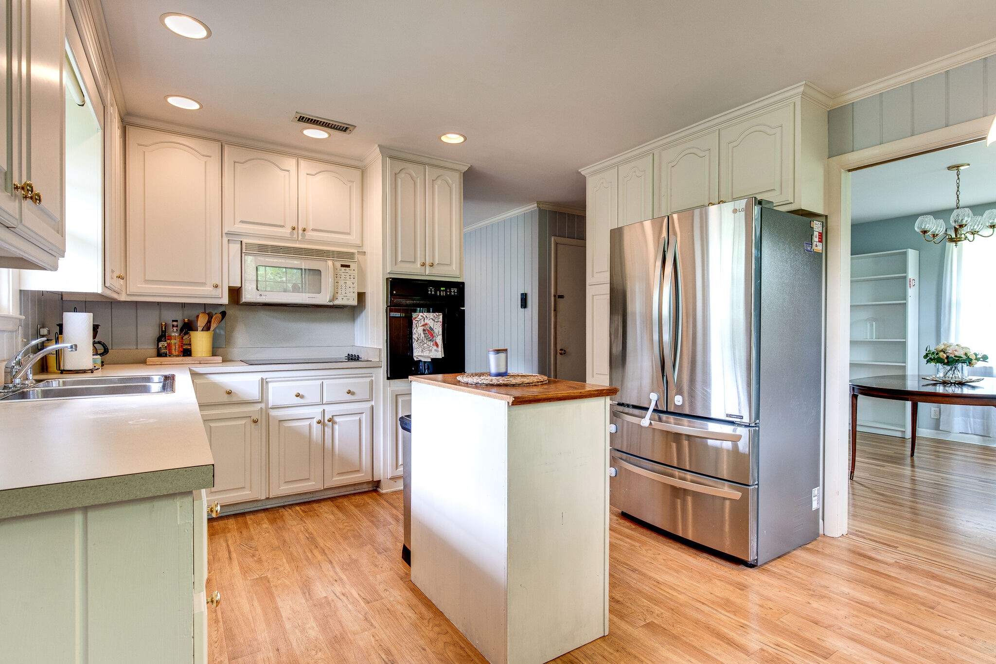 705 Vanoke Drive Madison, TN 37115 - Photo 11 of 44 a kitchen with kitchen island wooden cabinets and stainless steel appliances