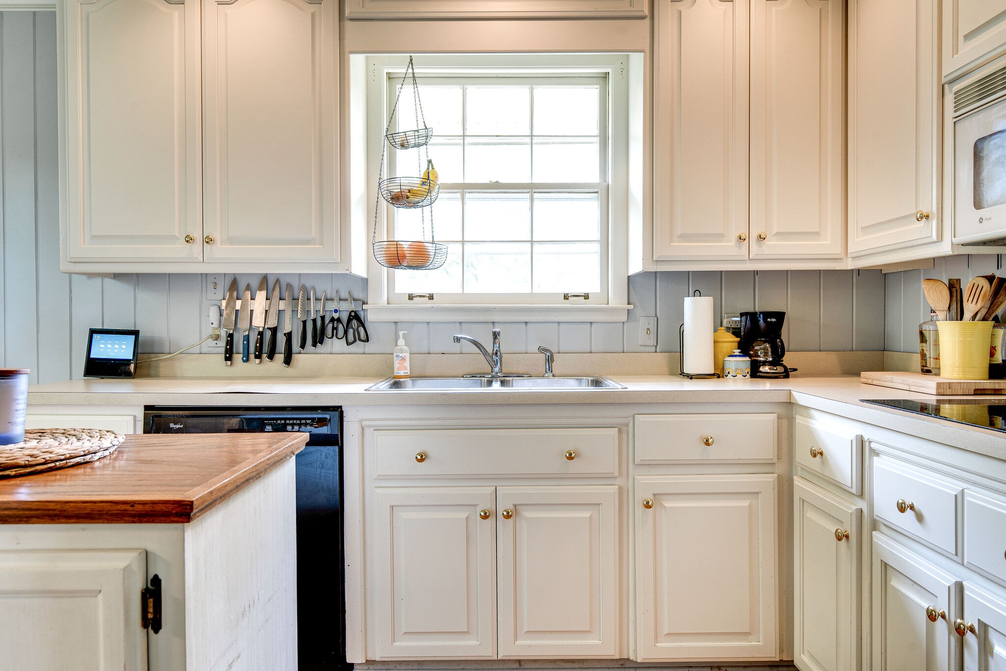 705 Vanoke Drive Madison, TN 37115 - Photo 13 of 44 a kitchen with white cabinets and sink