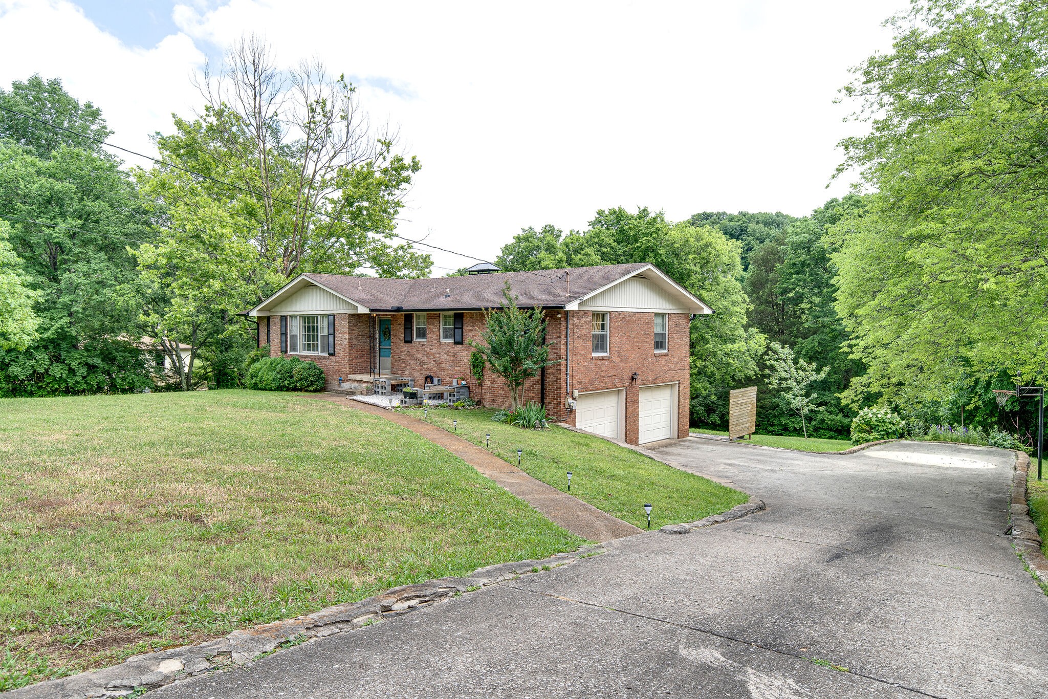 705 Vanoke Drive Madison, TN 37115 - Photo 3 of 44 a front view of a house with garden