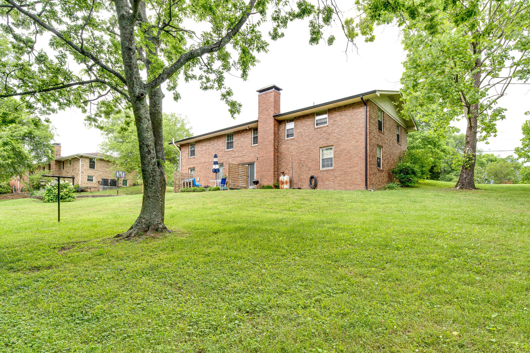705 Vanoke Drive Madison, TN 37115 - Photo 32 of 44 a view of a backyard with large trees and plants