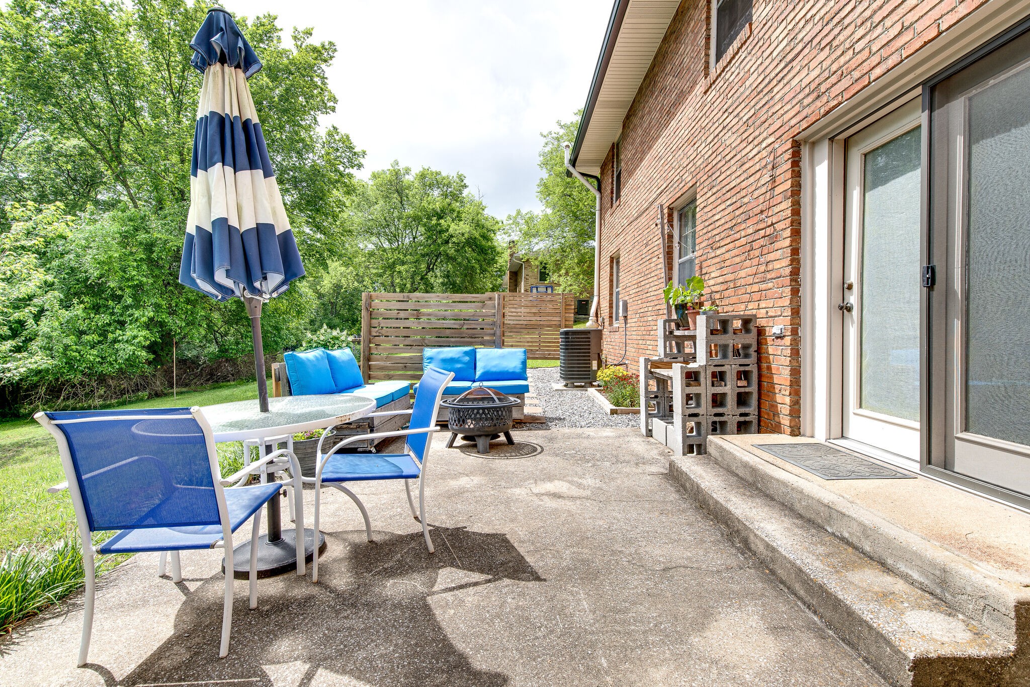 705 Vanoke Drive Madison, TN 37115 - Photo 34 of 44 a view of backyard with outdoor seating and trees in the background