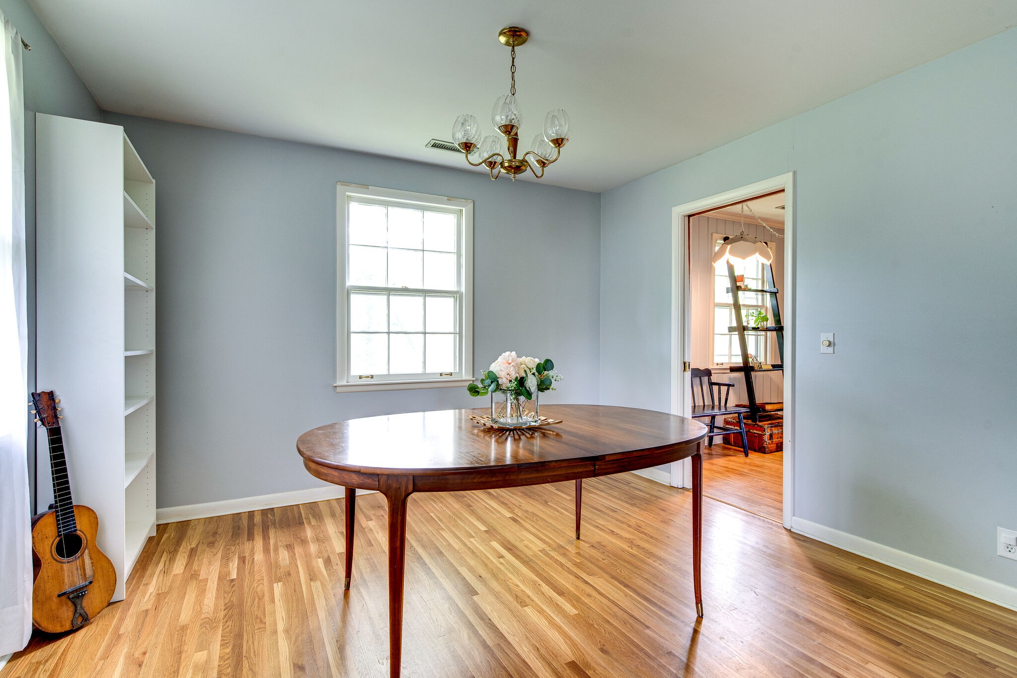 705 Vanoke Drive Madison, TN 37115 - Photo 9 of 44 a dining room with furniture a chandelier and wooden floor