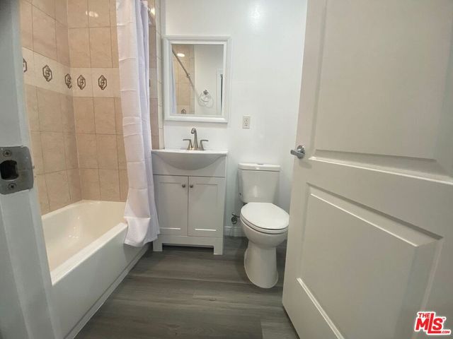 a bathroom with a toilet a sink and bathtub